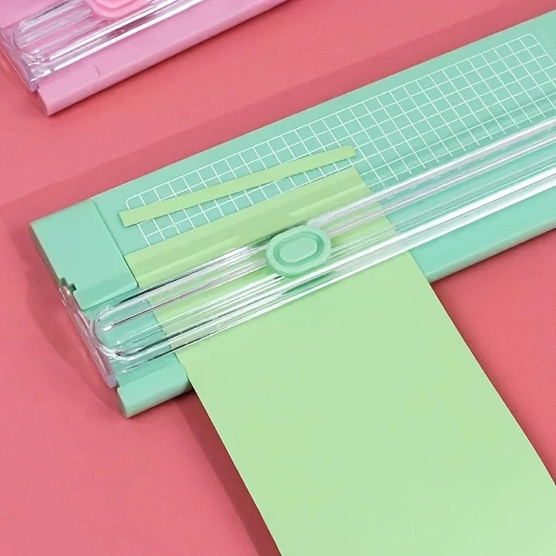 Green trimmer cutting paper