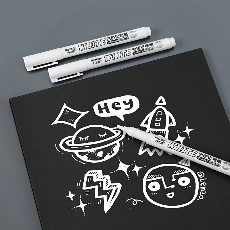 Black paper white pens